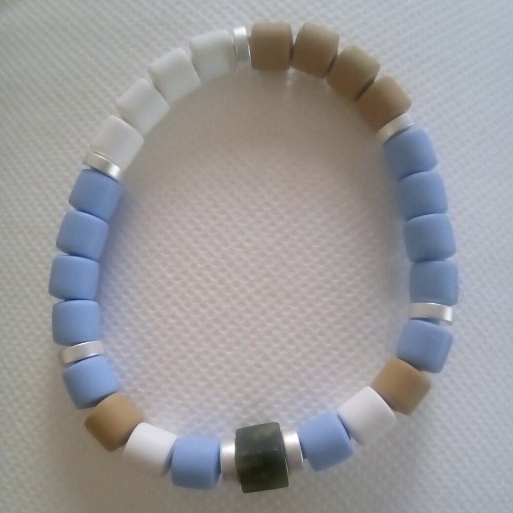 Bracelet...stretch bracelet, center mini dark green cube bead, 71/2 inches